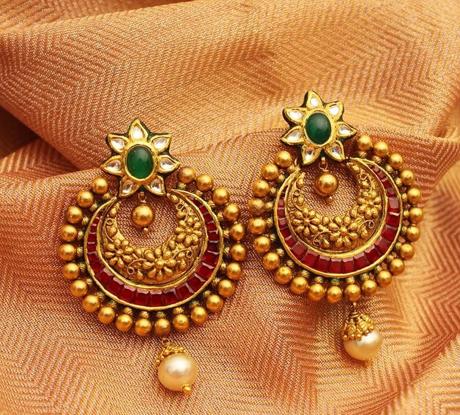 These beautifully detailed Chandbali earrings decorated with parrot  carvings and ruby stone hangings st… | Gold jewellery design, Chandbali  earrings, Jewelry design